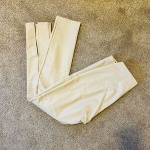 Calvin Klein Stretch Faux Leather Pants With Leg Slits in Off-White